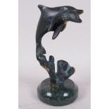A bronze figure of two dolphins on a marble socle, 6" high