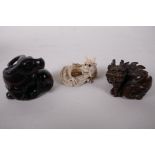 Two Japanese carved wood netsuke, a buffalo and dragon, and a carved ivory netsuke of a dragon