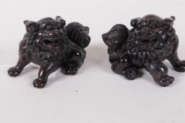 A pair of Japanese carved hardwood netsuke, signed with seal