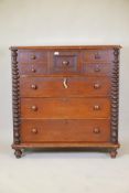 A C19th mahogany Scotch chest of drawers with bobbin turned side columns and four small top