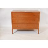 A mid century Loughborough Furniture teak chest of three long drawers, raised on tapering