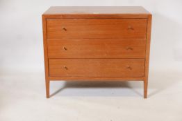 A mid century Loughborough Furniture teak chest of three long drawers, raised on tapering