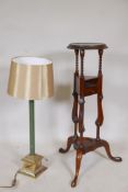 A Georgian style mahogany wig stand, 34" high, and a brass table lamp with malachite effect