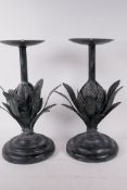 A pair of metal pricket candlesticks in the form of artichokes, 12" high