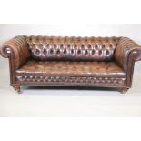 A brown leather chesterfield sofa, 78" wide, A/F
