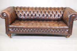 A brown leather chesterfield sofa, 78" wide, A/F