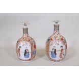 A pair of Meiji ceramic flasks with stoppers and decorated in enamels with peacocks and