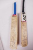 Two miniature 'Charity Sale' cricket bats, signed by 1990s West Indies and South African teams,