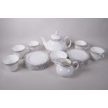 A Royal Doulton 'Arlington' pattern six place tea service with teapot, cream and sugar, 1 teacup