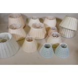 A quantity of pleated silk lamp shades, largest 17" x 11"
