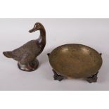 An Egyptian Revival engraved brass bowl supported by cast bird feet, 5" diameter and a bronze figure