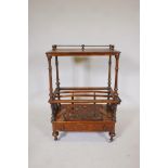 A Victorian inlaid burr walnut canterbury, with brass galleried top and central rack, over a