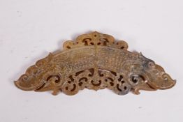 A Chinese carved and pieced hardstone pendant/scroll weight with stylised dragon decoration, 2" x 5"