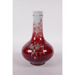 A Chinese porcelain bottle vase with a deep red and green glaze, six character mark to base, 7" high