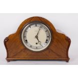 A walnut cased Westiminster chiming mantle clock with silvered chapter ring and Roman numerals, by