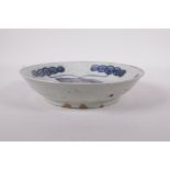 A Republic period porcelain shallow dish with blue and white carp decoration highlighted with red,