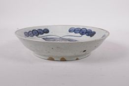 A Republic period porcelain shallow dish with blue and white carp decoration highlighted with red,