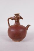 A Chinese porcelain phoenix pourer/wine jar with rust coloured glaze, 5" high