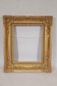 A C19th gilt and gesso picture frame, some losses, 32" x 27", A/F
