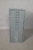 A 'Bisley precision office equipment' metal filing cabinet of  fifteen drawers, 18" x 14" x 34" high