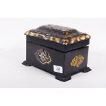 A Victorian papier mache two division tea caddy, with inset mother of pearl and gilt decoration,