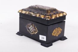 A Victorian papier mache two division tea caddy, with inset mother of pearl and gilt decoration,