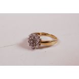 A 9ct yellow gold ring set with a cluster of diamonds, 0.5ct, 2.8g, size 'K'