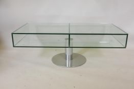 A late C20th glass coffee table on a pedestal base, 47" x 23", 17" high
