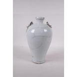 A Chinese crackleglazed porcelain vase with two dragon handles, 9" high