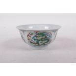A Doucai porcelain rice bowl decorated with dragons, six character mark to base, 4" diameter