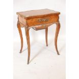 A French Louis XV style brass mounted tulip wood work table, the parquetry inlaid top lifting to