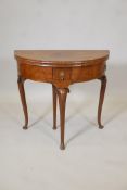 A Georgian mahogany and walnut folding card table with decorative inlay, single frieze drawer, on