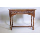 An Old Charm oak hall table with single frieze drawer and turned supports, 30" high, 36" wide, 17"