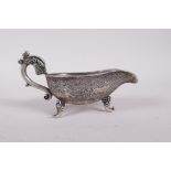 A Chinese white metal libation cup engraved with mythical creature decoration, four character mark