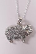 A sterling silver pig pendant necklace, 1" drop