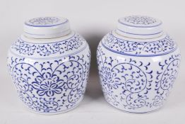 A pair of Oriental blue and white porcelain ginger jars and covers, 8" high