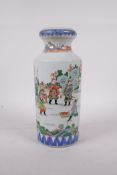 A Chinese famille vert porcelain cylinder vase with a waisted neck, decorated with warriors in a