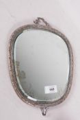 Oriental silver plated mirror, inset with bevelled glass, the back engraved with cranes under