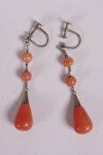 A pair of vintage gilt metal and coral drop earrings, 1" drop