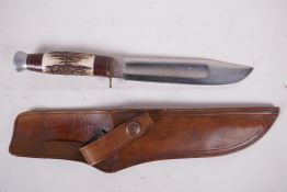 A Bowie knife by J. Nowill & Sons, Sheffield, with 8" blade and antler handle in a fitted leather