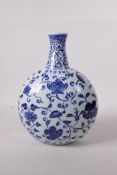 A blue and white porcelain flask with scrolling floral decoration, six character mark to side,