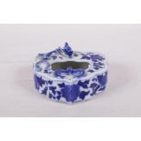 A Chinese blue and white porcelain ink well with applied bat and dragon decoration, 4" x 3"