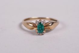 A 9ct yellow gold, emerald and diamond set ring, approx size N