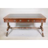 A Regency style mahogany six drawer partner's library table, with leather inset top, bears label