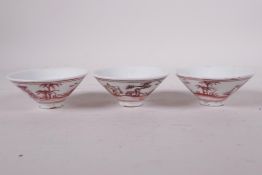 Three Chinese Ming style porcelain export tea bowls with red and white decoration of travellers,