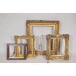 Three C19th gilt and gesso picture frames, some loses, largest 26" x 23", and a smaller oak frame,