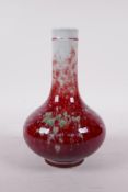 A Chinese porcelain bottle vase with a deep red and green glaze, six character mark to base, 7" high