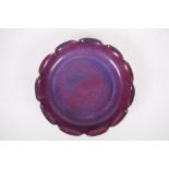 A Chinese Jun ware pottery dish with pleated rim and amethyst flambe glaze, 11" diameter