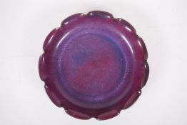 A Chinese Jun ware pottery dish with pleated rim and amethyst flambe glaze, 11" diameter