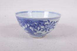 A Chinese blue and white porcelain rice bowl decorated with deer and peach trees, six character mark